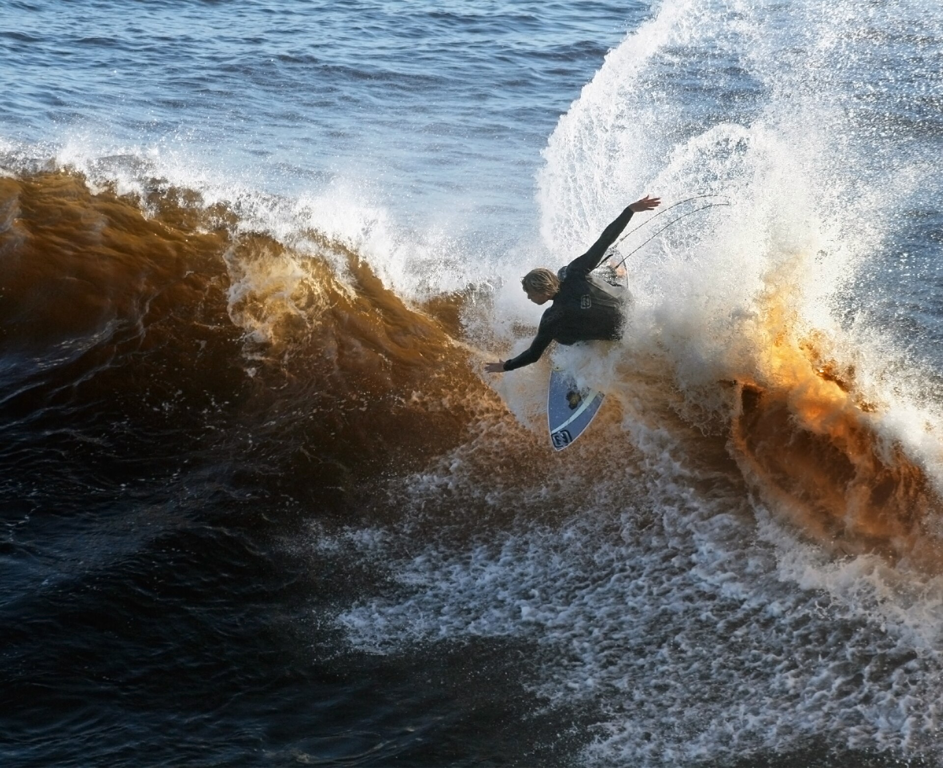 A surfer riding a wave — what a clean My Khe day looks like