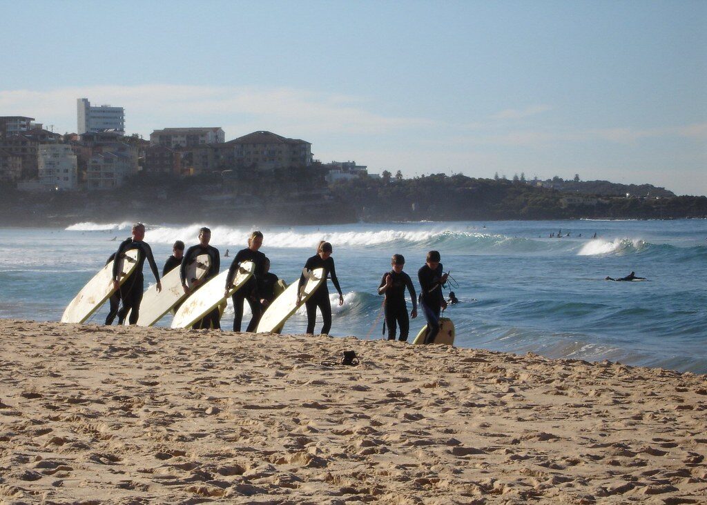 A surf school session getting ready on the sand