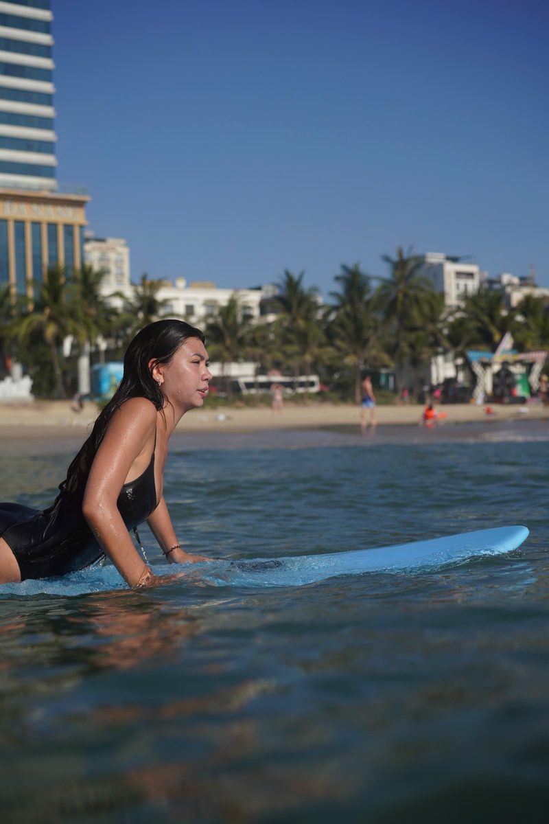 Paddling past palm trees and beachfront